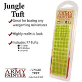 A clear blister pack holds rows of bright green miniature grass tufts, with “THE ARMY PAINTER” branding and “JUNGLE TUFT” on the label. Promotional text says “Includes 77 Tufts” and lists large, medium and small sizes.