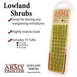 A clear blister pack holds rows of green and yellow-green shrub tufts. The promotional layout reads “Lowland Shrubs” and “THE ARMY PAINTER,” with checkmarked notes and a breakdown of 77 tufts in three sizes.