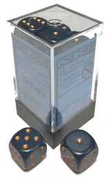 Opaque dusty blue six-sided dice with copper-colored pips are shown in a clear square dispenser and as two loose dice in the foreground. The dispenser label includes the lettering “CHX 25626.”