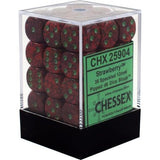 A clear display box with a black base holds rows of dark red dice flecked with green and marked with green pips. Its green label reads “CHX 25904” and “CHESSEX.”