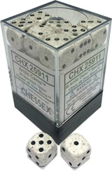 A clear square case filled with off-white D6 dice speckled in gray, each with black pips, stands behind two loose dice. The label reads “CHX 25911” and “Arctic Camo.”