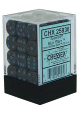A clear cube with a black base holds 36 dark speckled d6 dice, with blue pips and scattered colored flecks. The front label reads “CHX 25938,” “Speckled Blue Stars,” and “CHESSEX.”