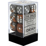 Copper-steel and white six-sided dice with white pips are stacked inside a clear display box with a black base. The front label reads “CHX 26624” and “CHESSEX.”