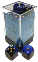 A clear rectangular case with a black base holds blue-and-black marbled six-sided dice with gold pips; two matching dice sit in front. The label reads “CHX 26635” and “Gemini.”