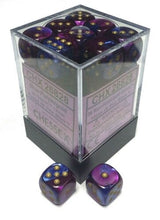 A clear square case with a black base holds many rounded-corner D6 dice in swirling blue and purple with gold pips. Two matching dice sit in front; pale labels with small printed lettering are visible on the case.