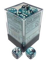 A clear cube display box with a dark base holds teal and black marbled six-sided dice with white pips; two matching dice sit in front. The box label shows “CHX 26846” and the “CHESSEX” logo.
