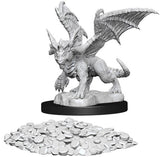 Gray, unpainted dragon wyrmling miniature crouches with wings spread on a rocky base, showing scales, horns, claws and a curled tail. A separate pile of small gray gem pieces is displayed below it on a white background.