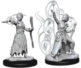 Two unpainted gray female human warlock miniatures on black round bases are shown side by side: one holds a staff and extends her hand, while the other poses with one arm raised amid large curling magical shapes.
