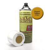 A Desert Yellow spray primer can stands beside its white cap lying on its side, showing a brown-gold color swatch. The can has a pale green label, black nozzle and the prominent text “THE ARMY PAINTER”; a round callout reads “Desert Yellow CP3011.”