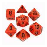 Seven orange-red polyhedral dice with mottled yellow-orange speckles and black numerals are arranged separately on a white background, showing a mix of triangular, square, and many-sided shapes.
