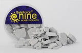 A clear round tub of gray concrete rubble mix sits behind a scattered pile of angular stone-like fragments. Its purple-and-yellow label reads “GaleForce nine” and “HOBBY SCENICS.”