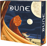 Dune board game box shown from the front and right side, with a giant orange sandworm rising from a golden desert beneath a dark blue sky and pale moons. The cover reads “DUNE” and “A GAME OF CONQUEST, DIPLOMACY & BETRAYAL”; the title also appears vertically on the side.