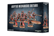 Box for Adeptus Mechanicus Skitarii miniatures, showing a group of red and metallic armored figures with weapons on bases across the front and one figure on the narrow side panel. The front reads “ADEPTUS MECHANICUS SKITARII” and “10 MINIATURES.”