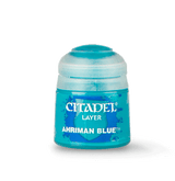 A turquoise-blue Citadel paint pot with a rounded white lid stands against a muted green background, casting a soft shadow. Its front label reads “CITADEL,” “LAYER,” and “AHRIMAN BLUE.”