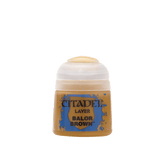 A squat ochre-brown paint pot with a rounded white flip-top lid stands against a solid dark green background. Its blue-and-brown label reads “CITADEL,” “LAYER,” and “BALOR BROWN.”