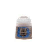 A small pot of tan-brown Citadel miniature paint with a rounded white lid, shown upright against a plain green background. The blue label reads “CITADEL,” “LAYER,” and “BANEBLADE BROWN.”