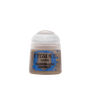 A small pot of tan-brown Citadel miniature paint with a rounded white lid, shown upright against a plain green background. The blue label reads “CITADEL,” “LAYER,” and “BANEBLADE BROWN.”