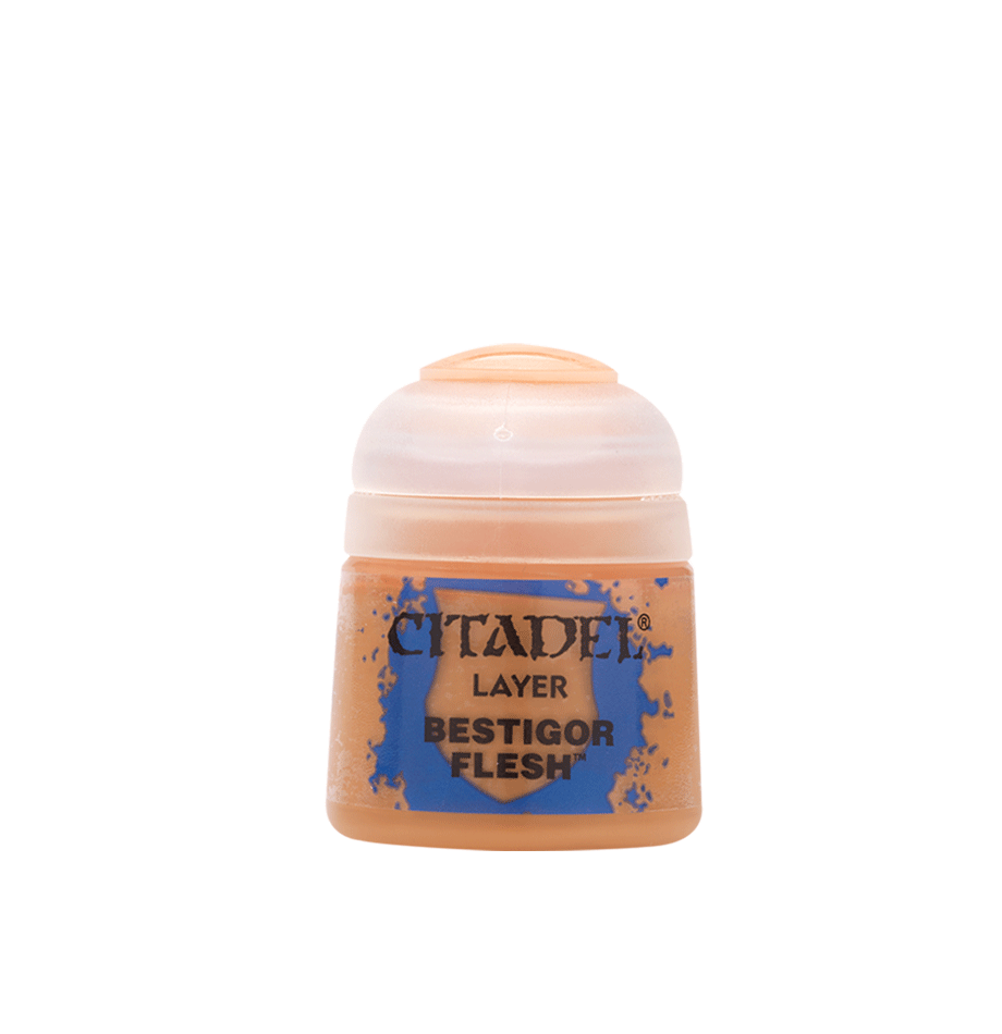 A squat paint pot with a translucent peach-colored cap and a tan label splashed with blue. The label reads “CITADEL,” “LAYER,” and “BESTIGOR FLESH.”