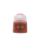 A small paint pot with a pale pink cap and dusty rose-brown paint visible through the translucent body. The front label reads “CITADEL,” “BASE,” and “BUGMAN’S GLOW.”