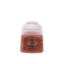 A small paint pot with a pale pink cap and dusty rose-brown paint visible through the translucent body. The front label reads “CITADEL,” “BASE,” and “BUGMAN’S GLOW.”