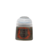 A small pot of dark green miniature paint with a rounded white flip-top lid and a red-and-gray label reading “CITADEL,” “BASE,” and “CASTELLAN GREEN.”