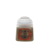 A small Citadel paint pot with a rounded white cap and an olive-brown body, shown upright against a muted green background. Its red-and-black label reads “CITADEL,” “BASE,” and “DEATHWORLD FOREST.”