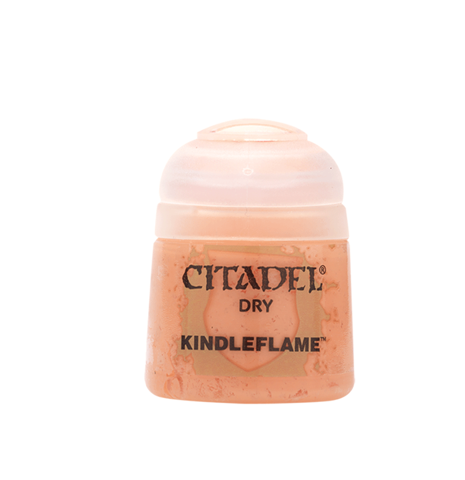 A small squat pot of peach-orange Citadel dry paint with a pale peach ridged flip-top lid, shown upright against a green background. The front label reads “CITADEL,” “DRY,” and “KINDLEFLAME.”