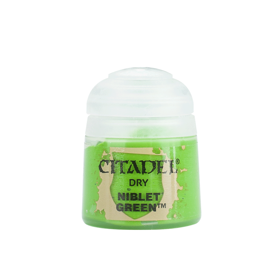 A small pot of bright green Citadel paint stands upright with a rounded white cap. The beige label reads “CITADEL,” “DRY,” and “NIBLET GREEN.”