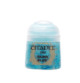 A small squat pot of bright blue paint with a rounded white lid, shown upright against a plain background. The front label reads “CITADEL,” “DRY,” and “SKINK BLUE.”