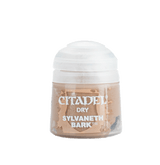 A small paint pot with a rounded white cap and a clear lower container filled with warm tan-brown paint. Its front label reads “CITADEL,” “DRY,” and “SYLVANETH BARK.”