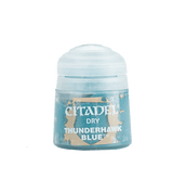 A squat Citadel paint pot with a rounded white lid and a blue label mottled with tan. The label reads “CITADEL,” “DRY,” and “THUNDERHAWK BLUE.”