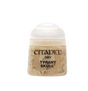 A small squat pot of beige miniature paint with a white rounded lid. Its mottled tan label reads “CITADEL,” “DRY,” and “TYRANT SKULL” in bold black lettering.