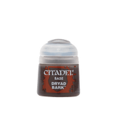 A small Citadel paint pot shown upright, with a translucent pale gray flip-top cap and a dark brown and rust-red label. The label reads “CITADEL,” “BASE,” and “DRYAD BARK.”