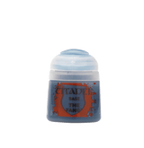 A small gray-blue paint pot with a pale translucent cap stands against a muted green background. Its orange-and-blue label reads “CITADEL,” “BASE,” and “THE FANG.”