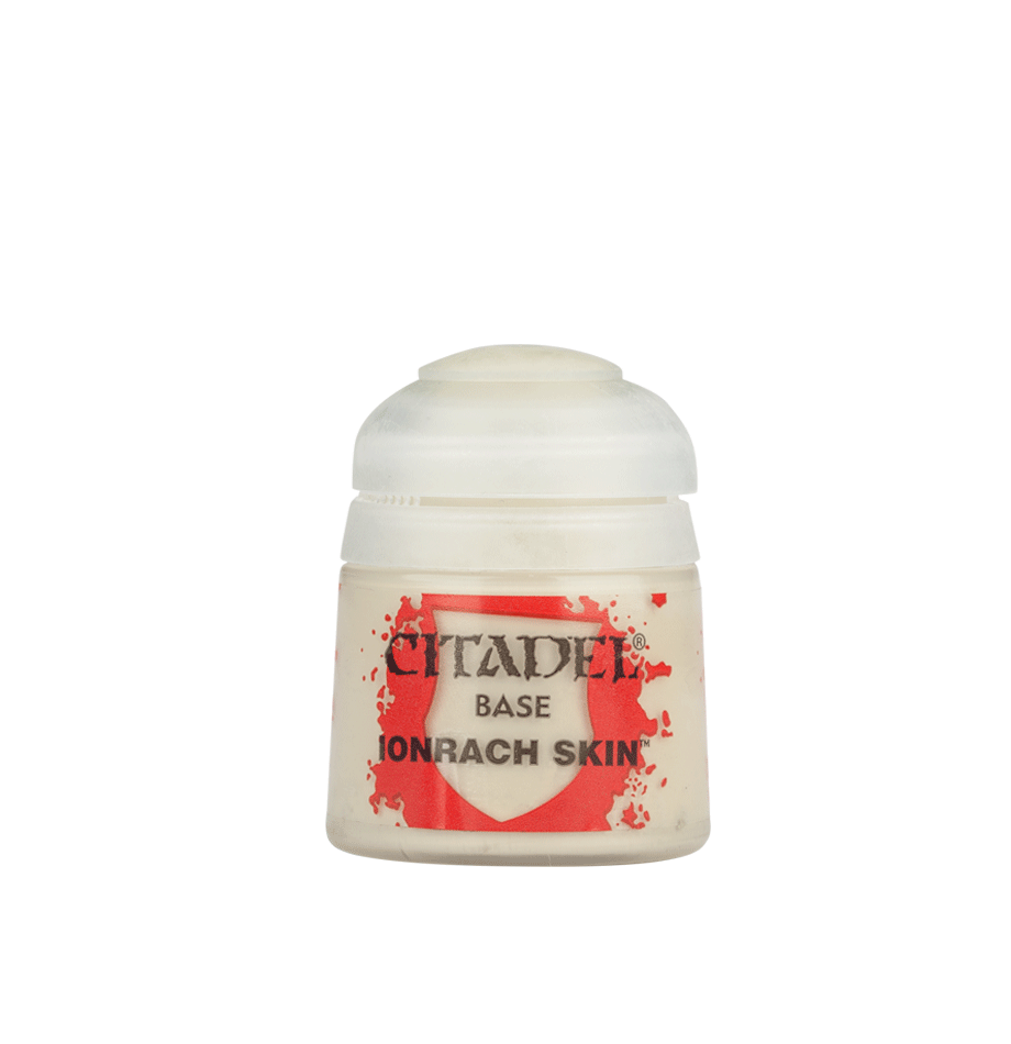 A small pale cream Citadel paint pot with a rounded white cap and red-and-white label, shown upright against a plain green background. The label reads “CITADEL,” “BASE,” and “IONRACH SKIN.”