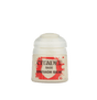 A small pale cream Citadel paint pot with a rounded white cap and red-and-white label, shown upright against a plain green background. The label reads “CITADEL,” “BASE,” and “IONRACH SKIN.”