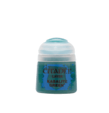 A squat pot of green miniature paint with a white ridged cap, shown upright against a solid dark green background. Its blue-and-green label reads “CITADEL,” “LAYER,” and “KABALITE GREEN.”