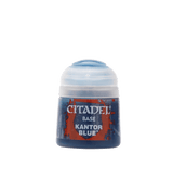 A small pot of dark blue paint with a white cap, shown upright against a plain background. Its red-and-blue label reads “CITADEL,” “BASE,” and “KANTOR BLUE.”