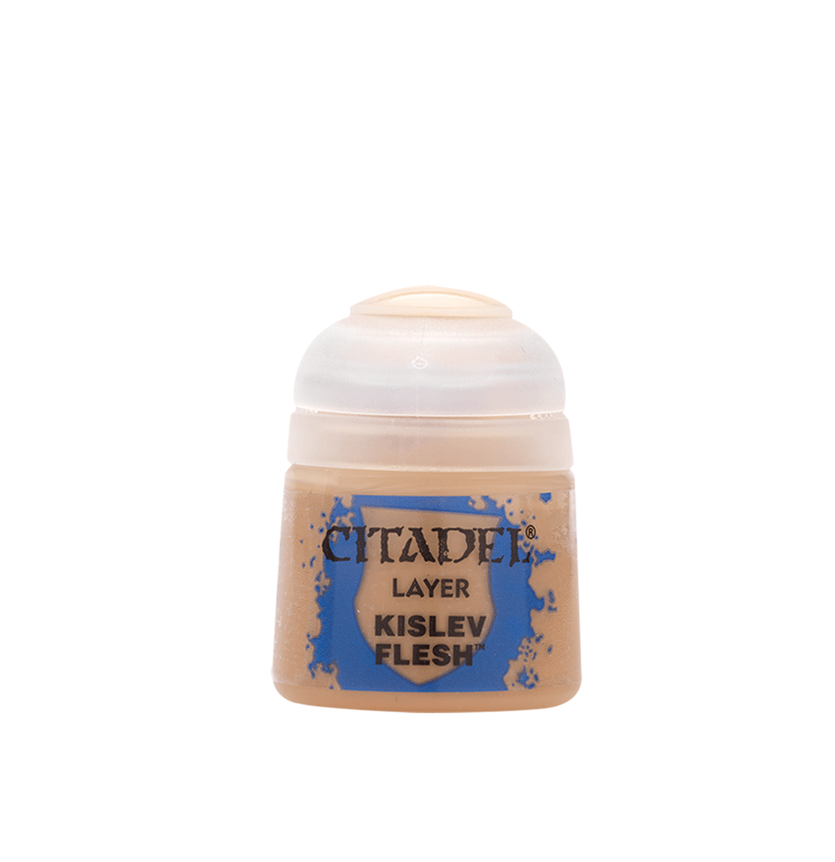 A small squat paint pot with peach-tan paint, a translucent white cap and a blue-and-tan label, shown upright against a solid dark green background. The label reads “CITADEL,” “LAYER” and “KISLEV FLESH.”
