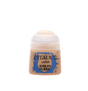 A small squat paint pot with peach-tan paint, a translucent white cap and a blue-and-tan label, shown upright against a solid dark green background. The label reads “CITADEL,” “LAYER” and “KISLEV FLESH.”