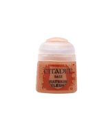 A small pot of peachy tan miniature paint with a pale translucent flip-top lid and orange-red label. The label reads “CITADEL,” “BASE,” and “RATSKIN FLESH.”