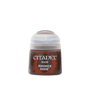 A squat Citadel paint pot with a pale gray cap and a dark brown label accented in red. The label reads “CITADEL,” “BASE,” and “RHINOX HIDE.”