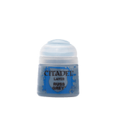 A small blue-gray Citadel paint pot with a rounded white flip-top cap, shown upright against a plain background. Its label reads “CITADEL,” “LAYER,” and “RUSS GREY.”