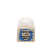 A small Citadel paint pot with a rounded white cap and a beige label framed by blue splatter graphics. The label reads “CITADEL,” “LAYER,” and “SCREAMING SKULL.”