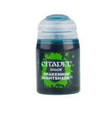 A small dark blue paint pot with a rounded white cap, shown upright against a plain background. Its green splatter label reads “CITADEL,” “SHADE,” and “DRAKENHOF NIGHTSHADE.”