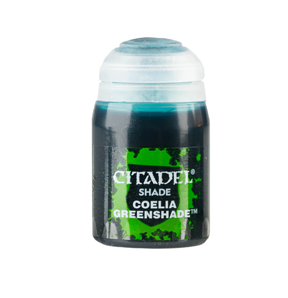 A small Citadel shade paint pot stands upright with a white cap and a dark label splashed with bright green. The label reads “CITADEL,” “SHADE,” and “COELIA GREENSHADE.”