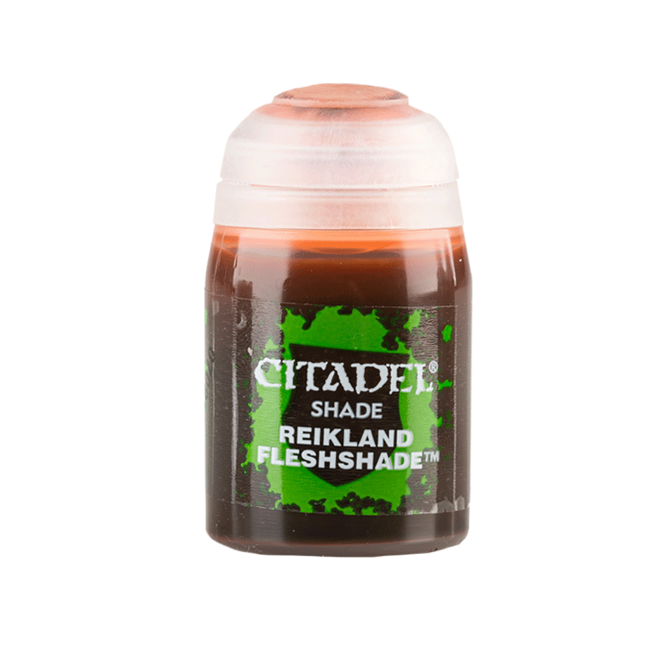 A small upright Citadel shade paint pot with a white cap and dark reddish-brown liquid. Its green-and-black label reads “CITADEL,” “SHADE,” and “REIKLAND FLESHSHADE.”