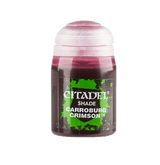 A small paint bottle stands upright against a plain green background, with a white cap and dark crimson liquid visible through the container. Its black-and-green label reads “CITADEL” and “SHADE CARROBURG CRIMSON.”