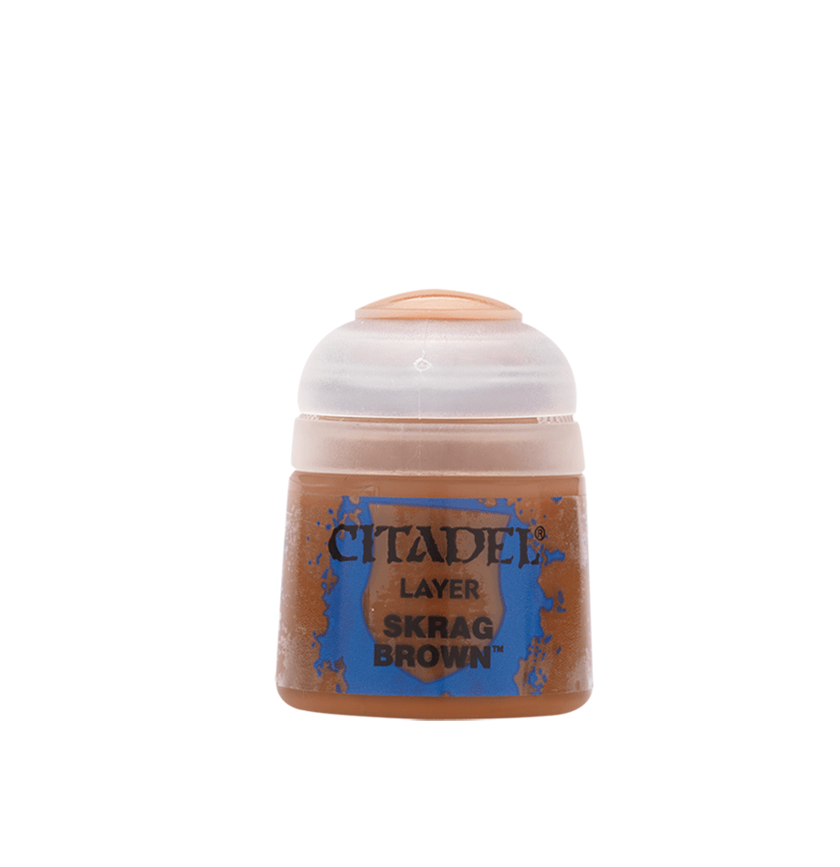 A small brown paint pot with a pale translucent cap and a blue-edged label against a solid green background. The label reads “CITADEL,” “LAYER,” and “SKRAG BROWN.”