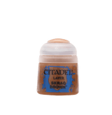A small brown paint pot with a pale translucent cap and a blue-edged label against a solid green background. The label reads “CITADEL,” “LAYER,” and “SKRAG BROWN.”